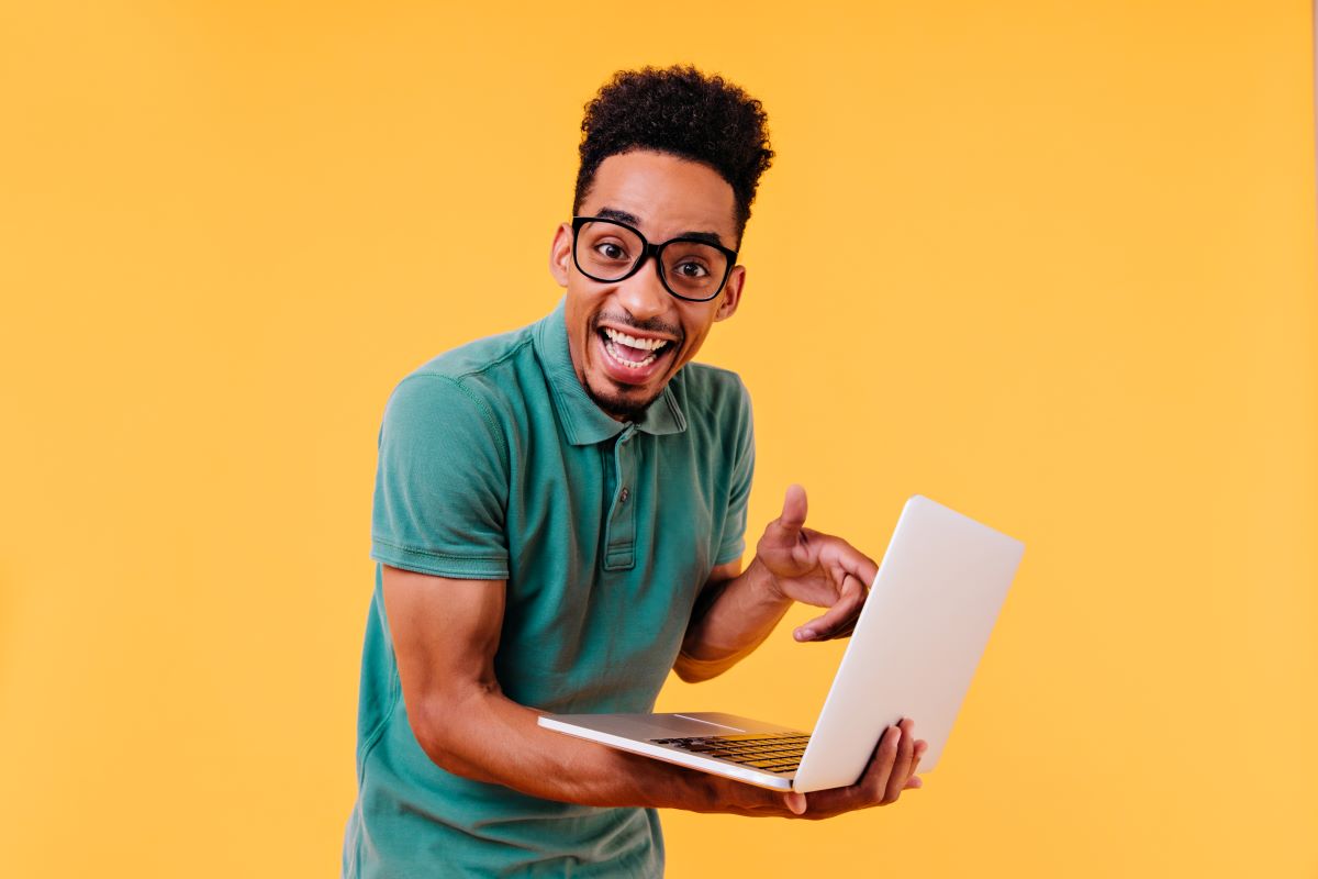 young adult with laptop