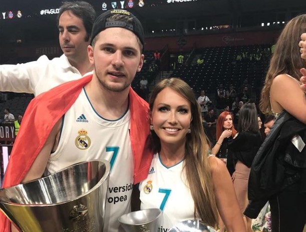 Luka Doncic and his mother pose for the cameras