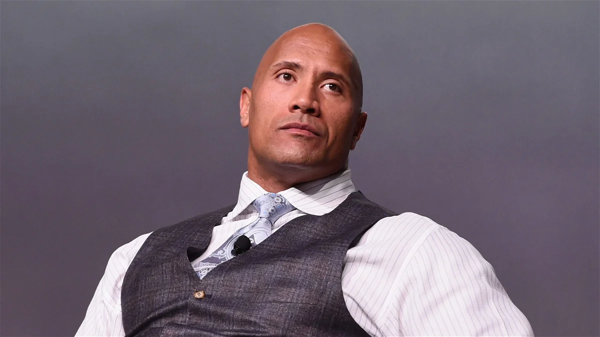 Dwayne The Rock Johson in business attire attending a conference