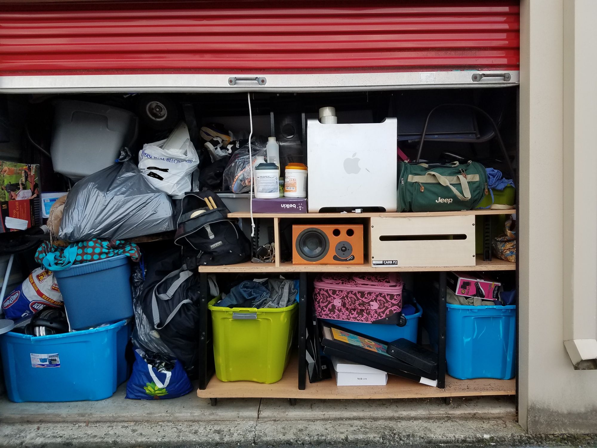 A picture of a storage unit containing different items stored by owners